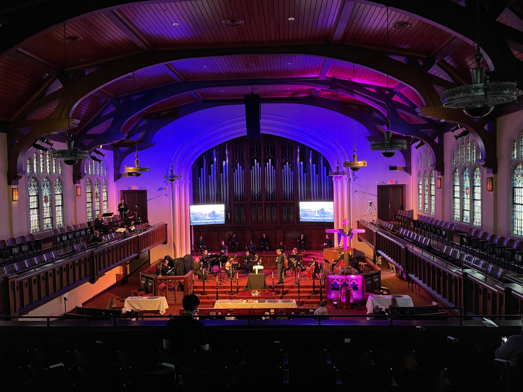 Christmas Eve candlelight service at First Presbyterian Baton Rouge with full balcony, lit Christmas tree, and choir at the platform.