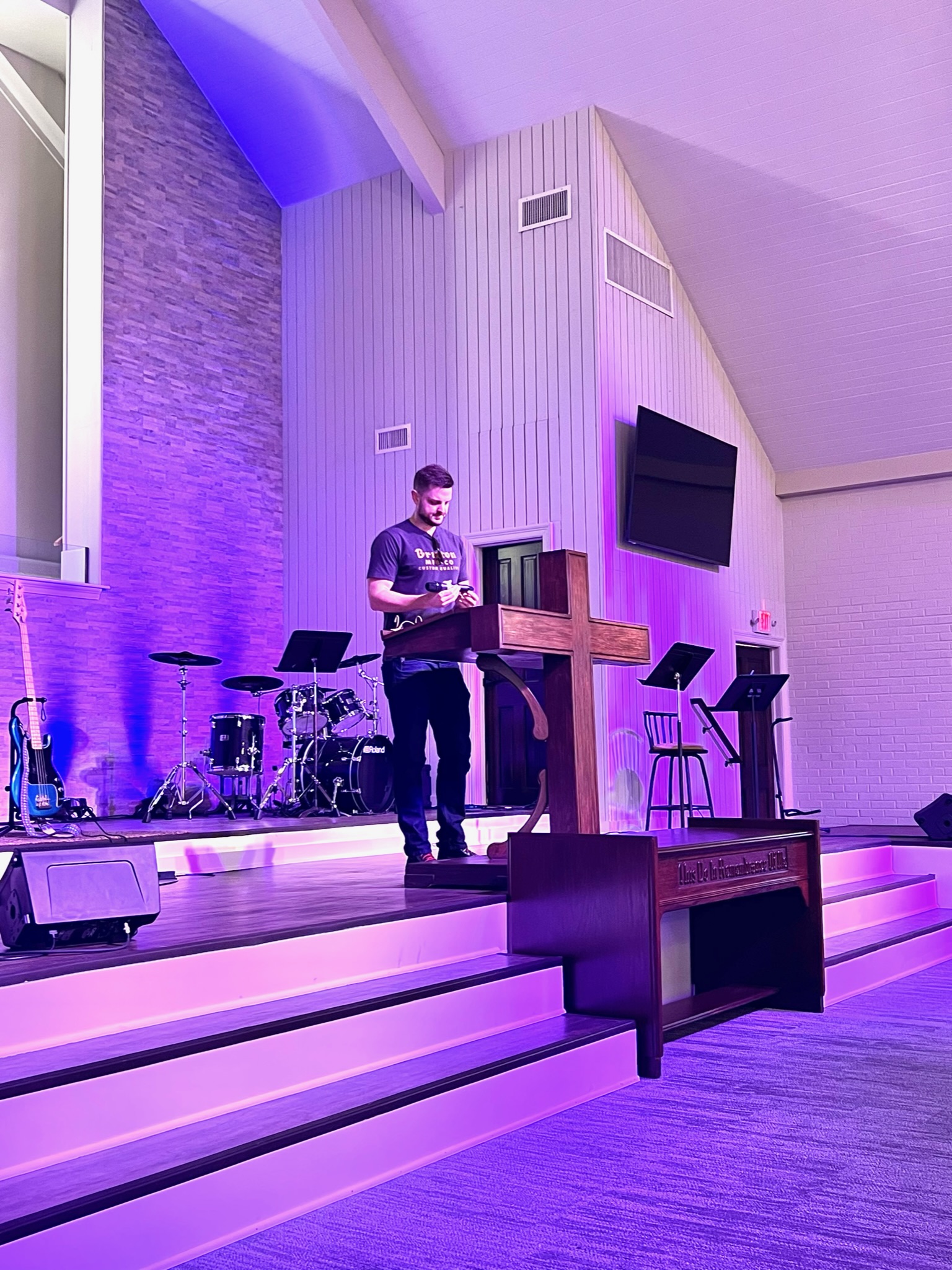 Galilee Baptist stage in a programmed lighting state — Elation fixtures washing the platform during a service moment.