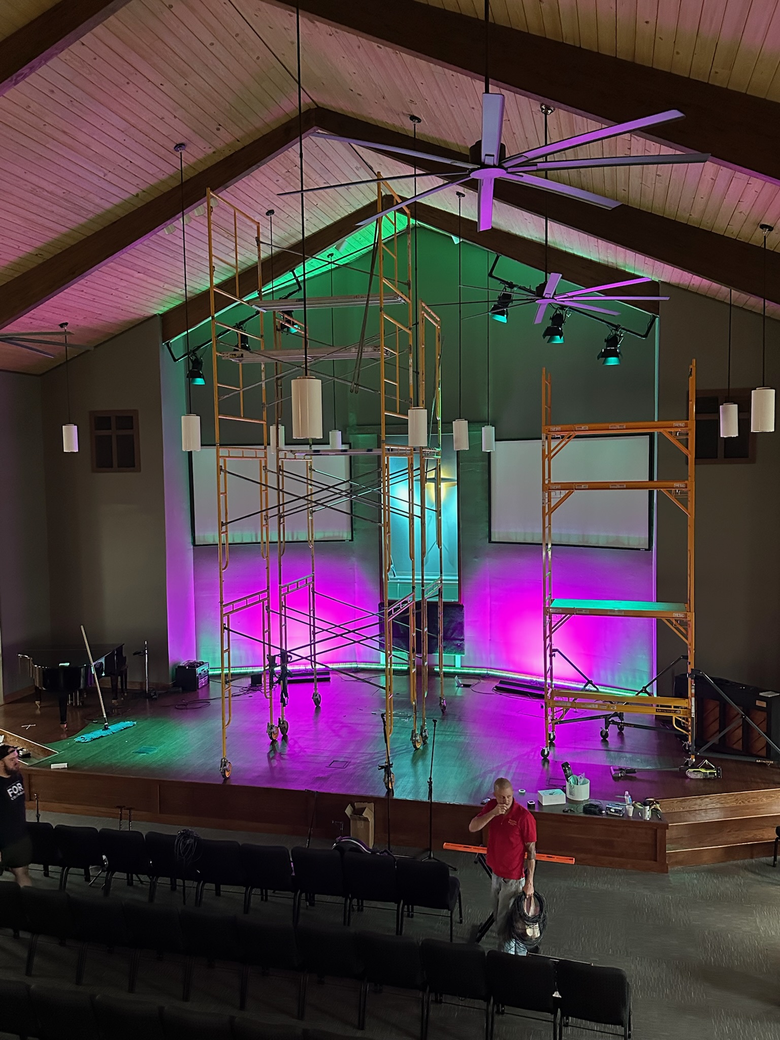 Istrouma Ascension during worship — the new Elation Cyc L wash on the back wall and the overhead bar lit alongside the existing wall-wash bars.